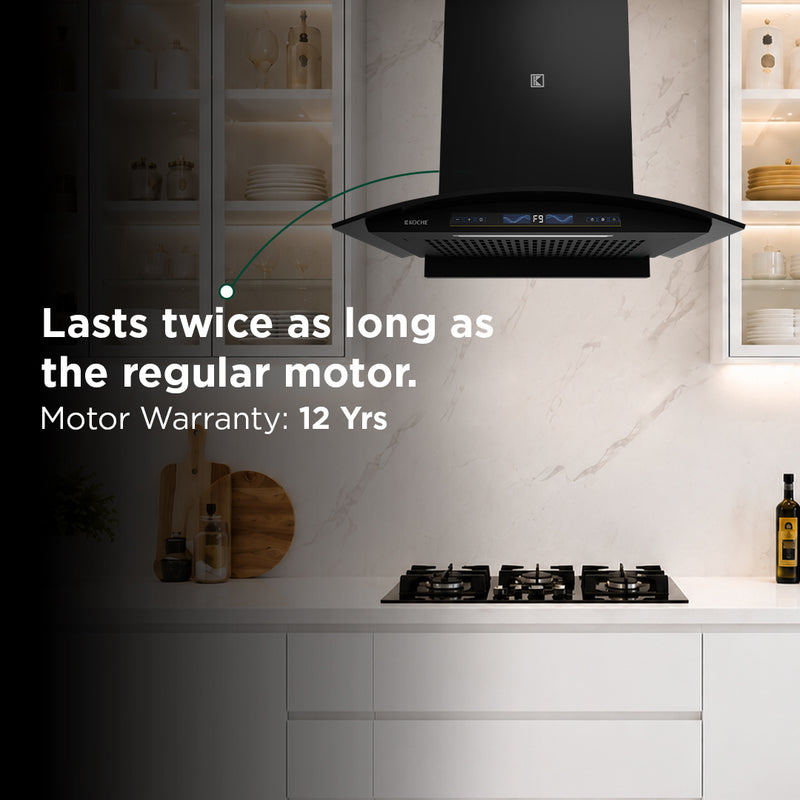   Enzo 60cm Ducted BLDC Chimney | 1450 CMH Powerful Suction | Auto Clean Köche Enzo 60 BLDC kitchen chimney highlighting a 12-year motor warranty, featuring a sleek black built-in design in a modern kitchen. 