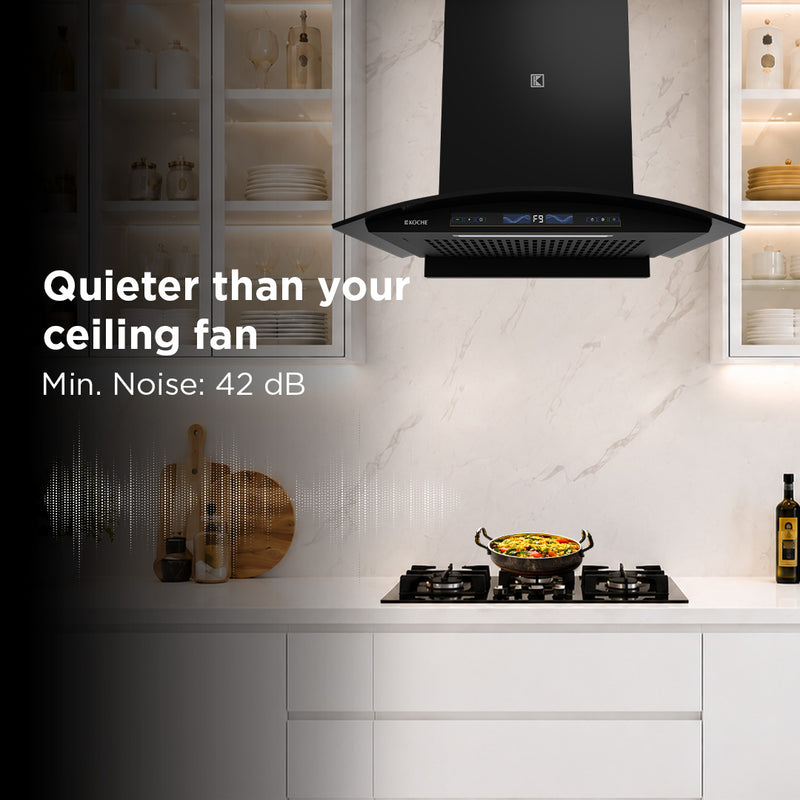   Enzo 60cm Ducted BLDC Chimney | 1450 CMH Powerful Suction | Auto Clean Köche Enzo 60 BLDC kitchen chimney installed in a modern kitchen, highlighting low noise operation with a sleek black built-in design. 