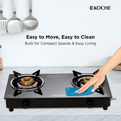 Köche portable 2 burner gas stove with a hand cleaning it