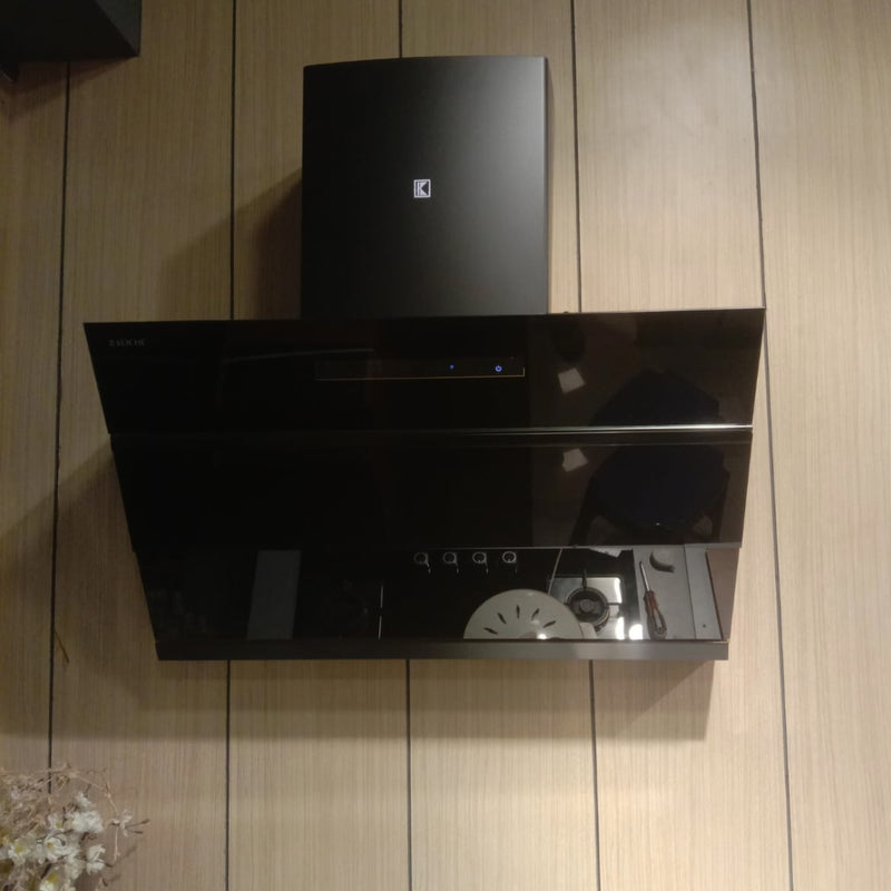   Laura 90 BLDC Chimney Köche Laura black chimney mounted on wooden wall in modern kitchen 