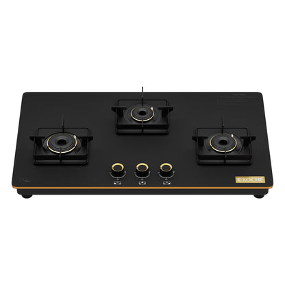 Black 3 burner gas hob with gold accents on a white background.