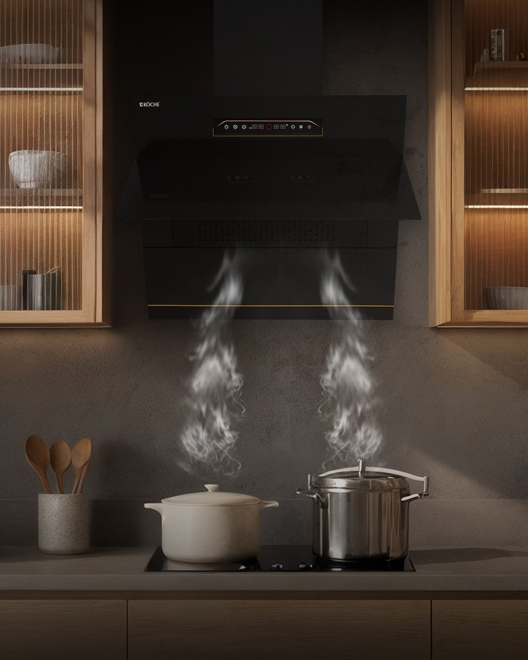 Modern kitchen with Köche built-in chimney removing smoke while cooking