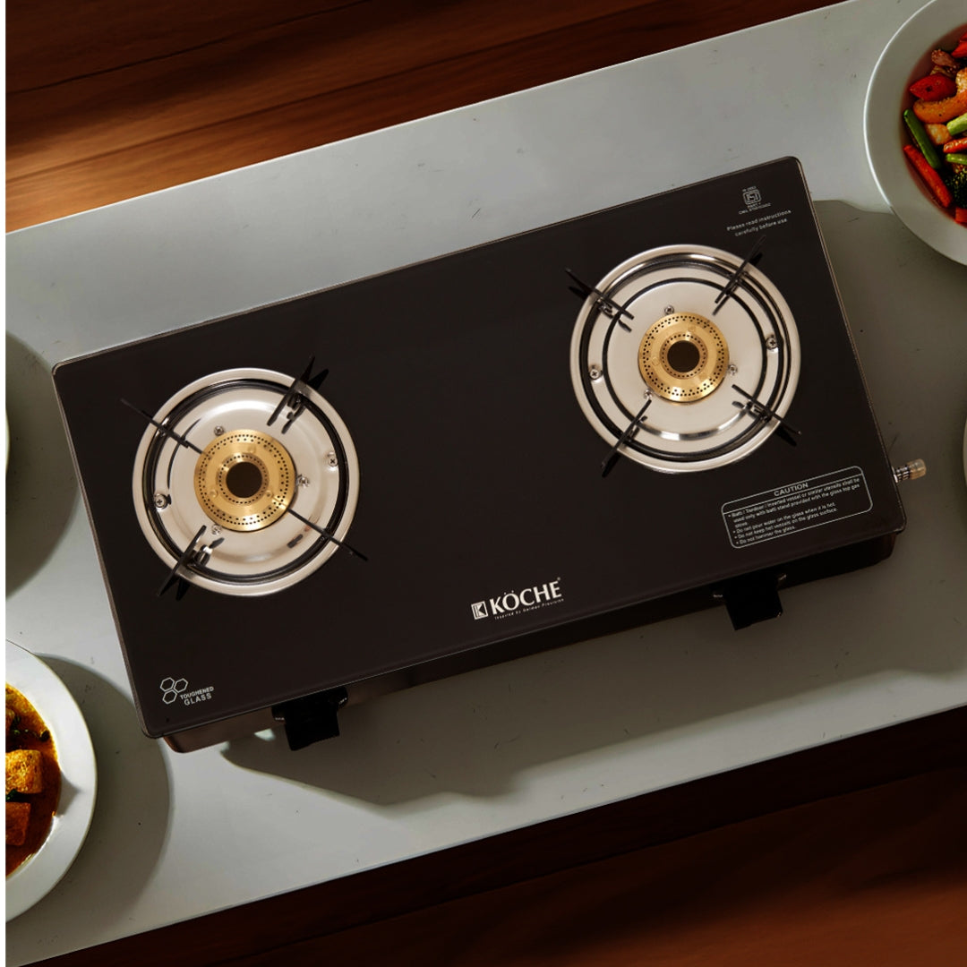 Köche two-burner gas stove on kitchen counter with branding